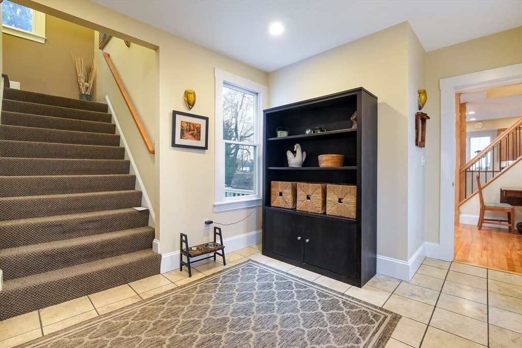 159 Warren Street Needham, MA 02492 - Photo 3 of 42 a view of an entryway with wooden floor and windows