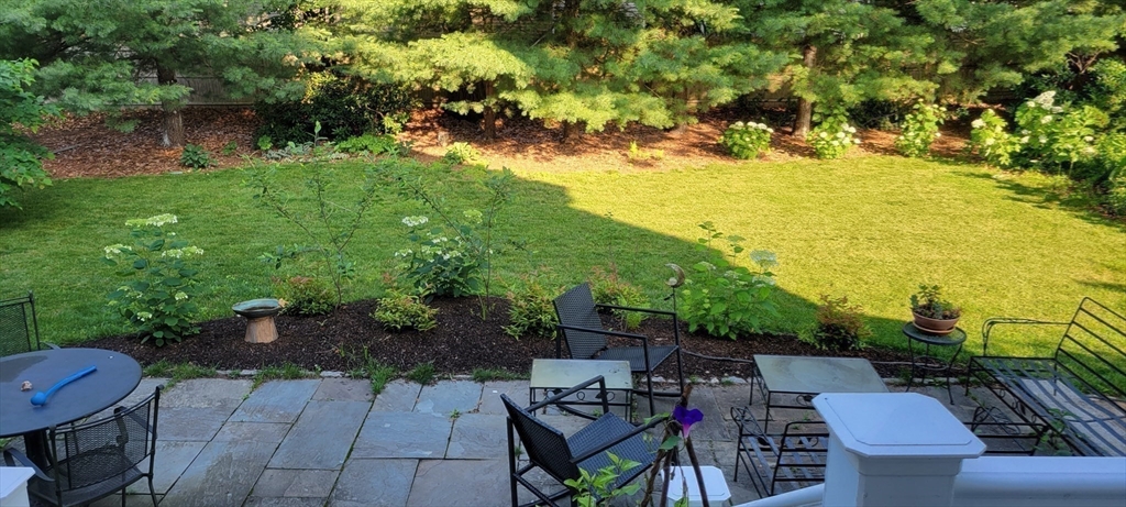 159 Warren Street Needham, MA 02492 - Photo 32 of 42 a view of a backyard with sitting area