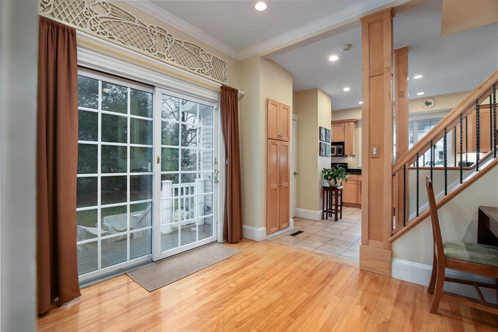 159 Warren Street Needham, MA 02492 - Photo 8 of 42 a view of an entryway with wooden floor and windows