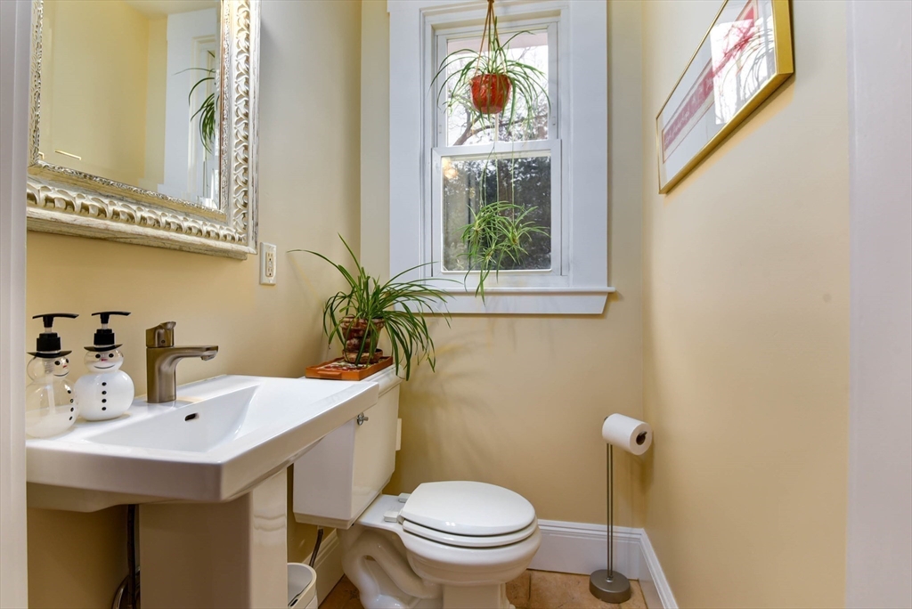 159 Warren Street Needham, MA 02492 - Photo 9 of 42 a bathroom with a sink a toilet and a mirror