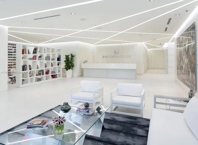 a living room with furniture and white walls