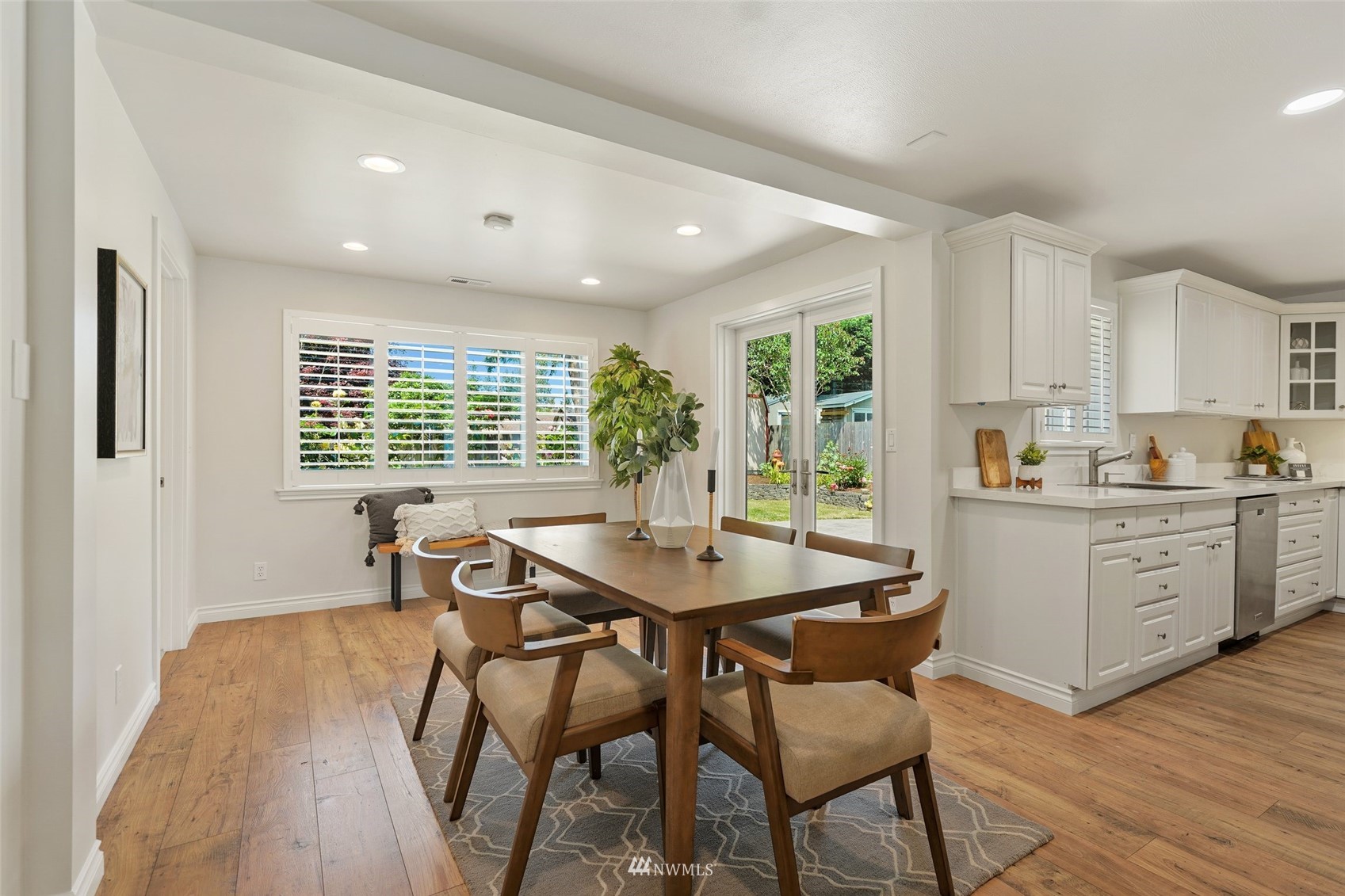3007 Stafford Way Bothell, WA 98012 - Photo 12 of 32 a view of a dining room with furniture windows and wooden floor
