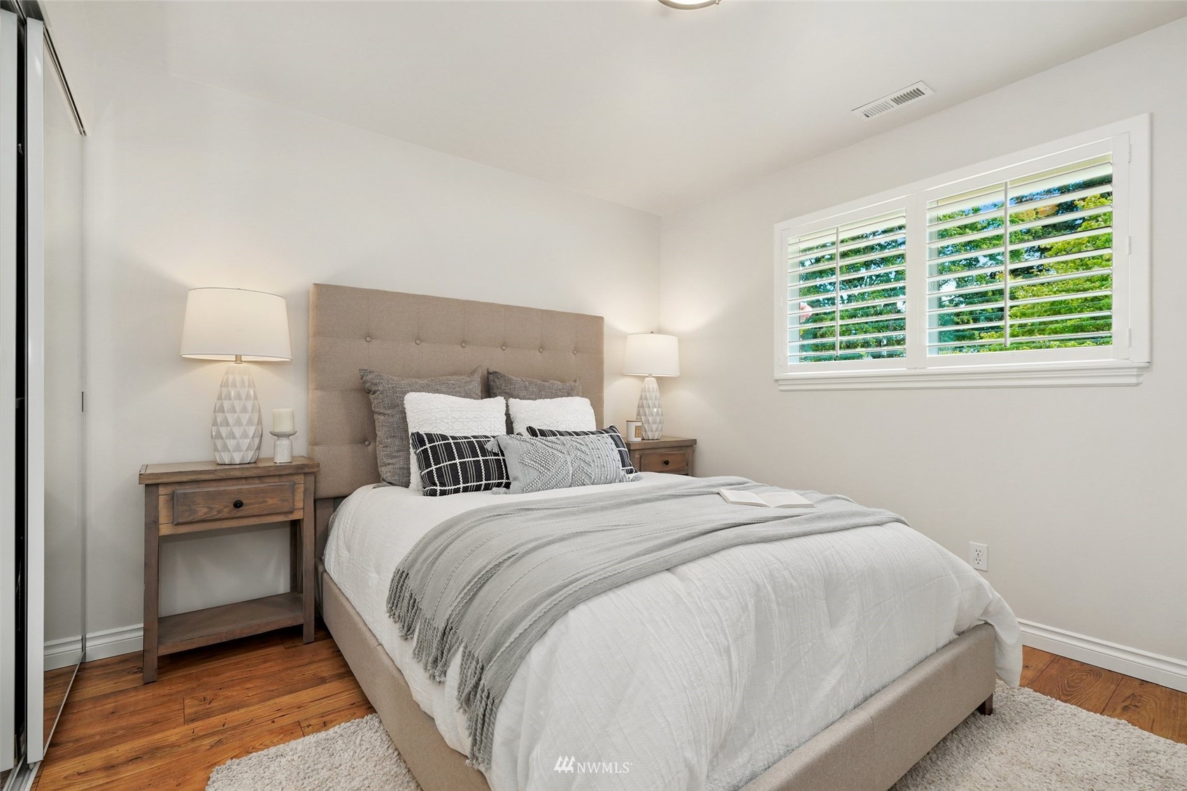 3007 Stafford Way Bothell, WA 98012 - Photo 19 of 32 a large bed sitting in a bedroom next to a window