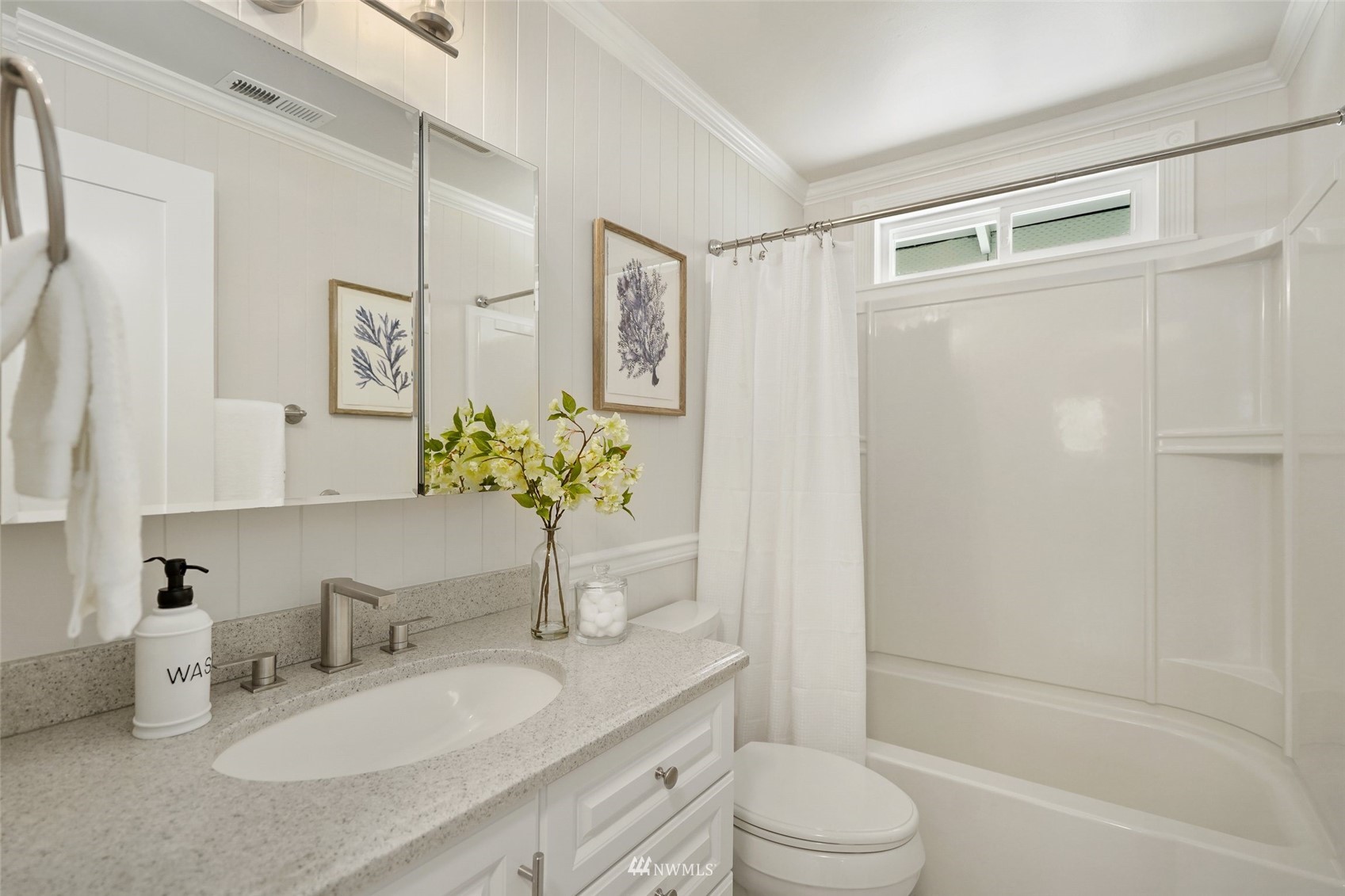 3007 Stafford Way Bothell, WA 98012 - Photo 23 of 32 a bathroom with a granite countertop sink toilet a large mirror a shower and a bathtub
