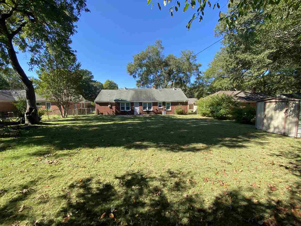322 McElroy Road Memphis, TN 38120 - Photo 2 of 16 a view of a garden with plants and trees