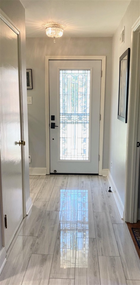 322 McElroy Road Memphis, TN 38120 - Photo 5 of 16 a view of an empty room with window and wooden floor
