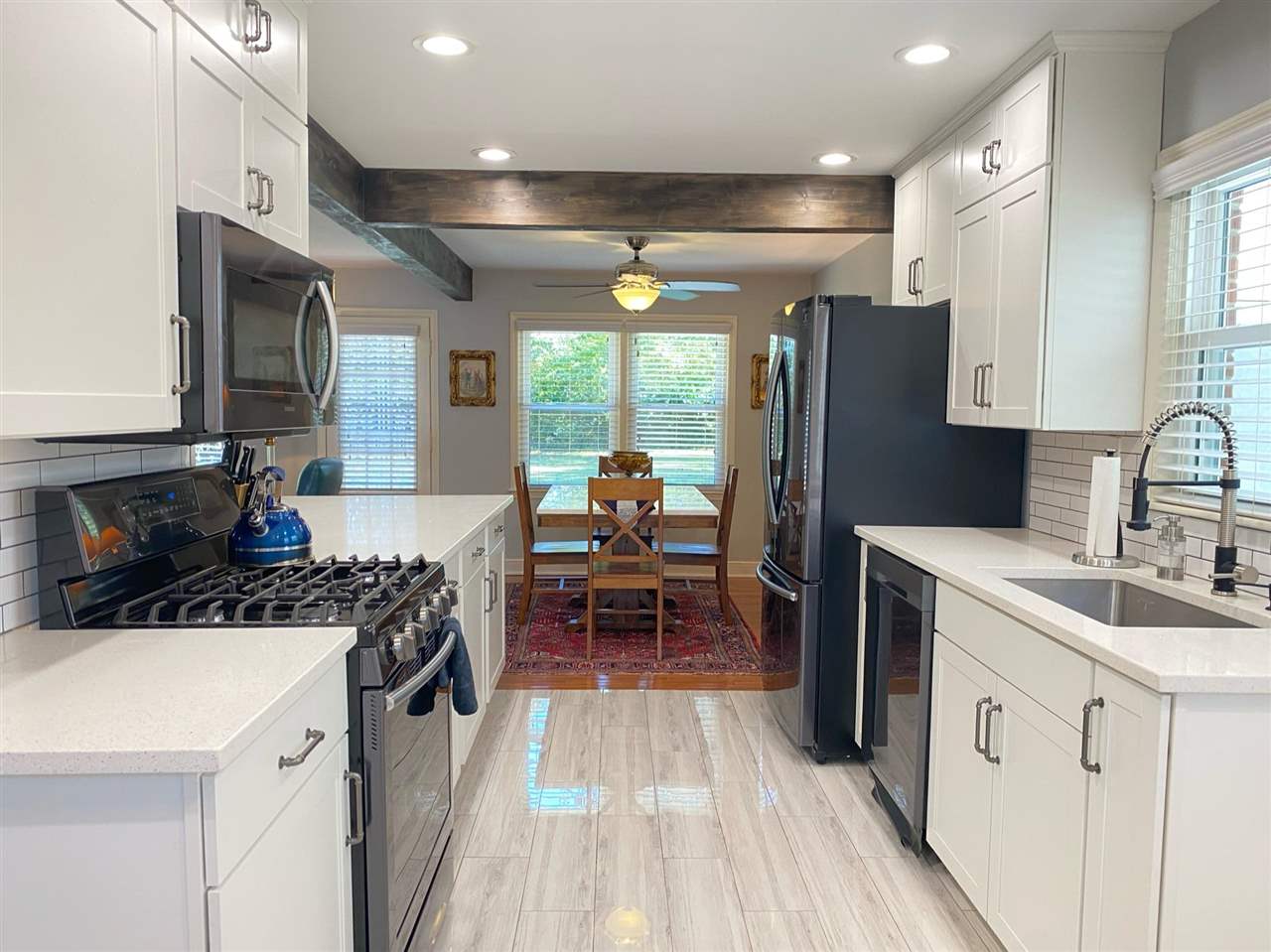 322 McElroy Road Memphis, TN 38120 - Photo 6 of 16 a kitchen with a sink stove and refrigerator