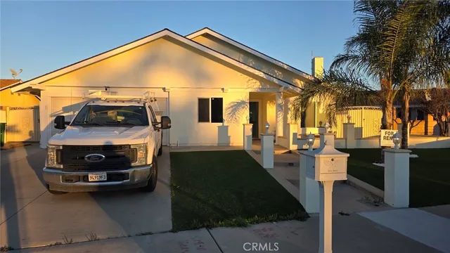 a view of a car park in front of house