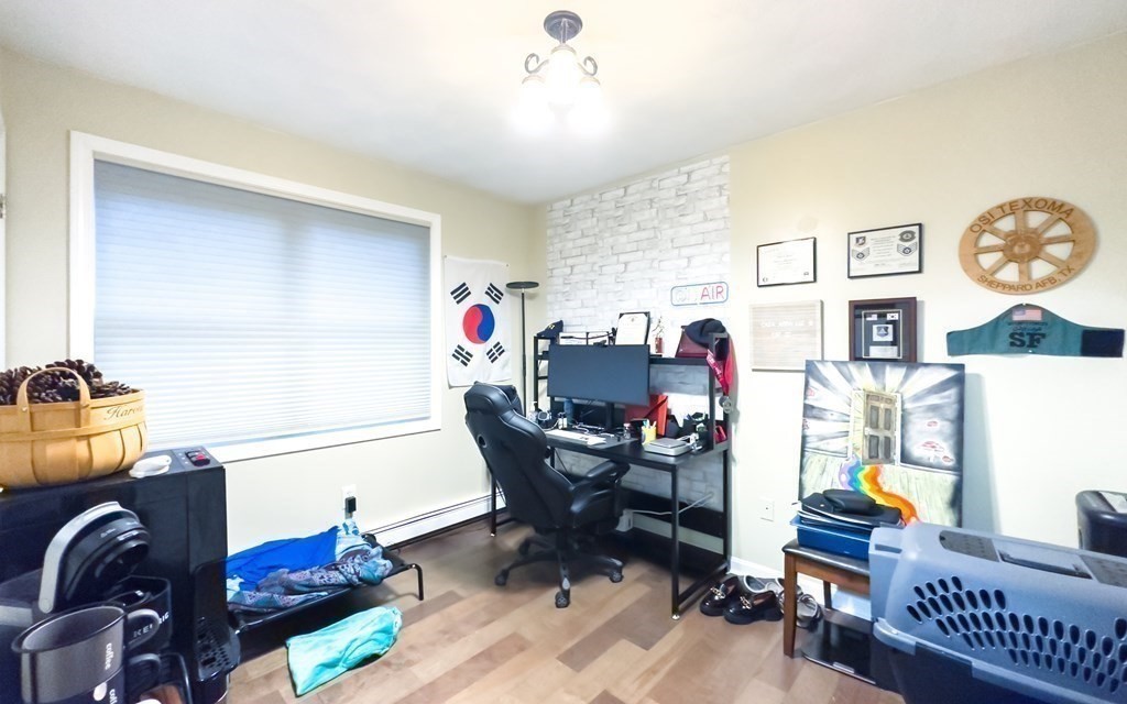 308 Acropolis Road Lowell, MA 01854 - Photo 12 of 21 a living room with furniture and a wooden floor