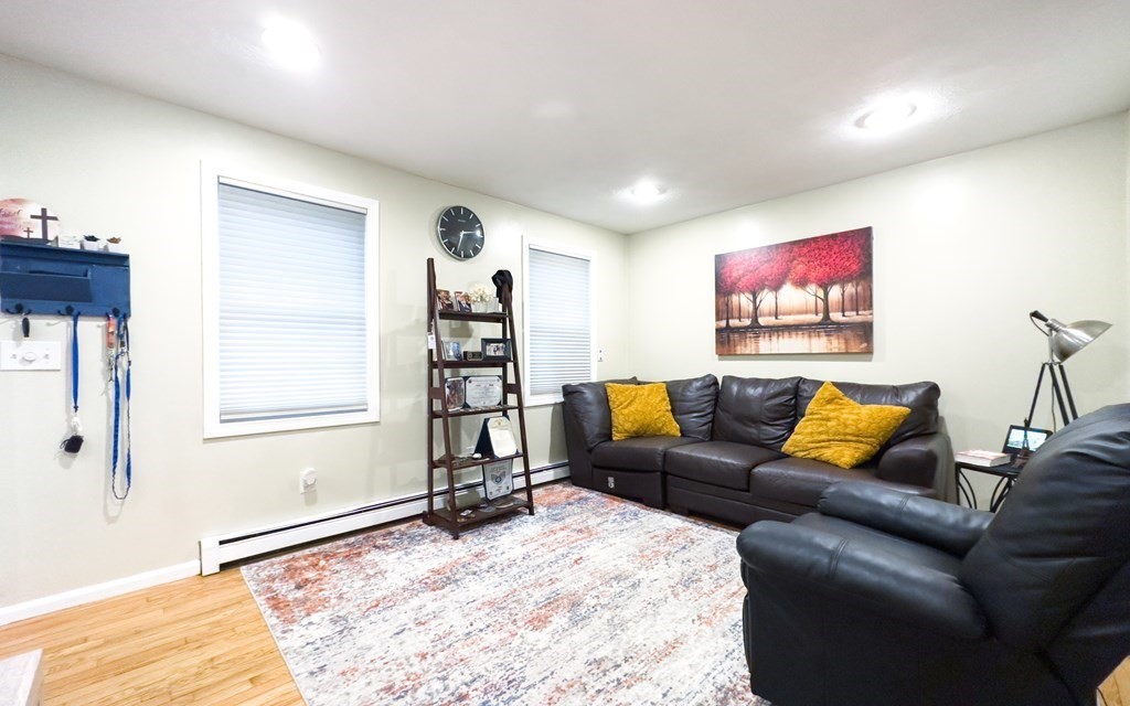 308 Acropolis Road Lowell, MA 01854 - Photo 8 of 21 a living room with furniture and a flat screen tv