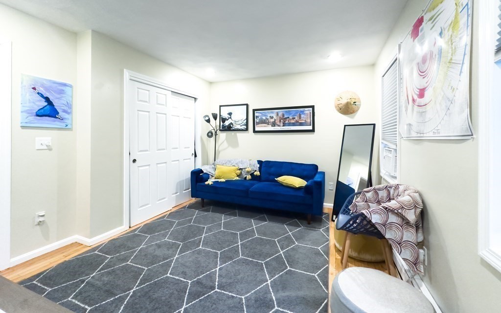 308 Acropolis Road Lowell, MA 01854 - Photo 9 of 21 a living room with furniture and a table