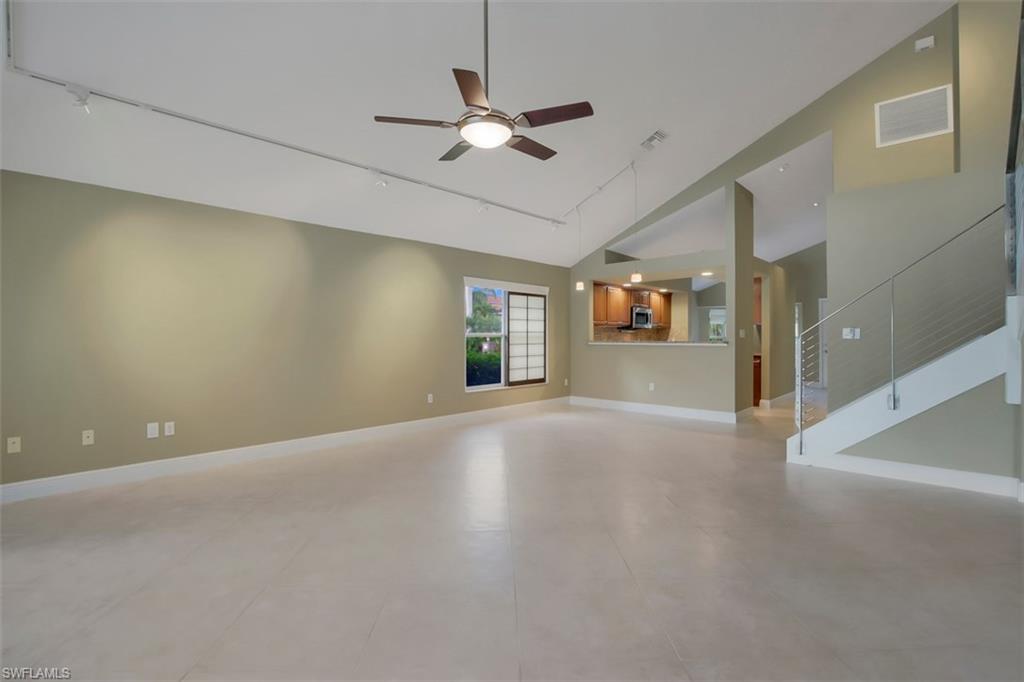 3578 Midas Place Naples, FL 34105 - Photo 15 of 21 a view of a livingroom with a ceiling fan and window