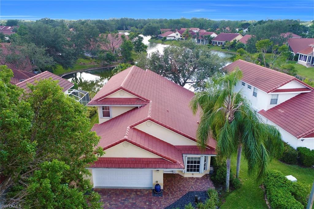 3578 Midas Place Naples, FL 34105 - Photo 18 of 21 an aerial view of residential houses with outdoor space and trees