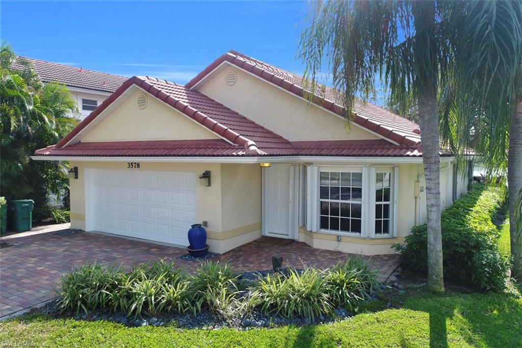 3578 Midas Place Naples, FL 34105 - Photo 21 of 21 a front view of a house with a yard