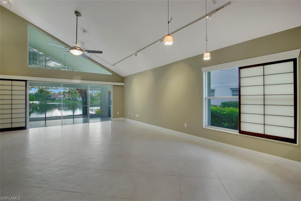3578 Midas Place Naples, FL 34105 - Photo 3 of 21 a view of empty room with floor to ceiling window and ceiling fan