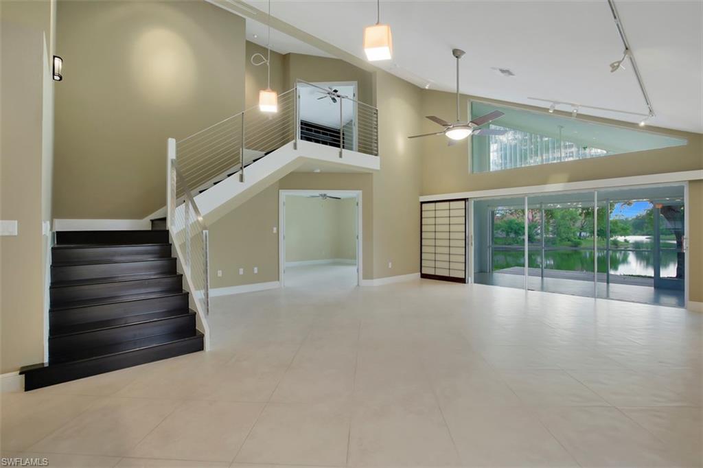 3578 Midas Place Naples, FL 34105 - Photo 4 of 21 a view of an empty room with a fireplace