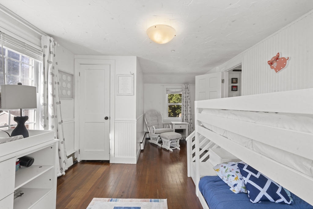 446 Ralph Talbot Street Weymouth, MA 02190 - Photo 18 of 28 a living room with furniture and a wooden floor
