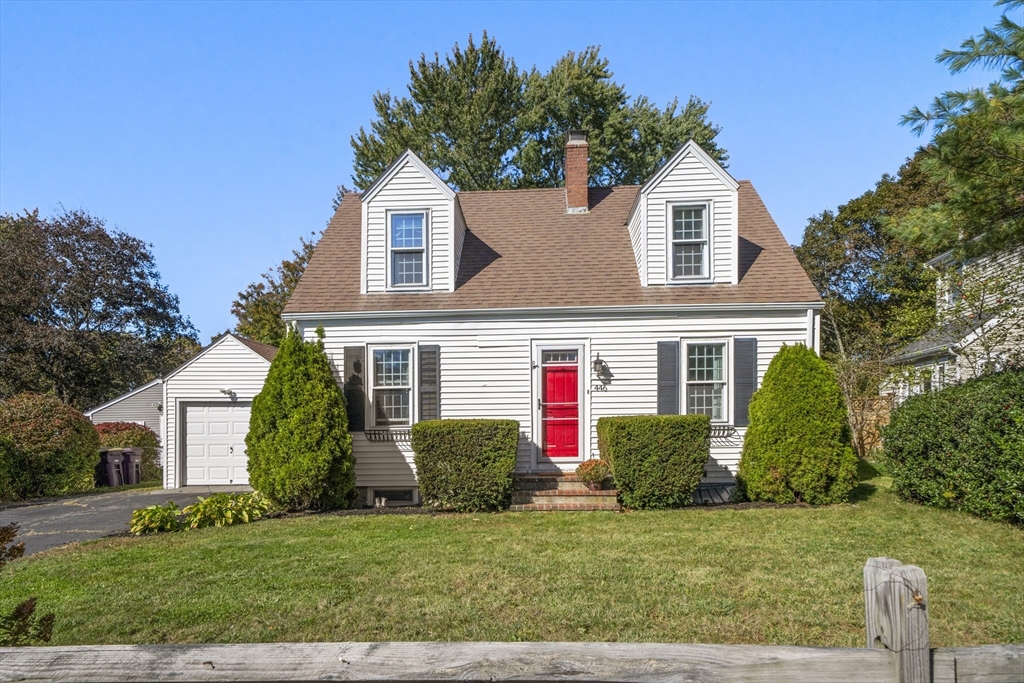446 Ralph Talbot Street Weymouth, MA 02190 - Photo 2 of 28 a front view of a house with a yard and garage