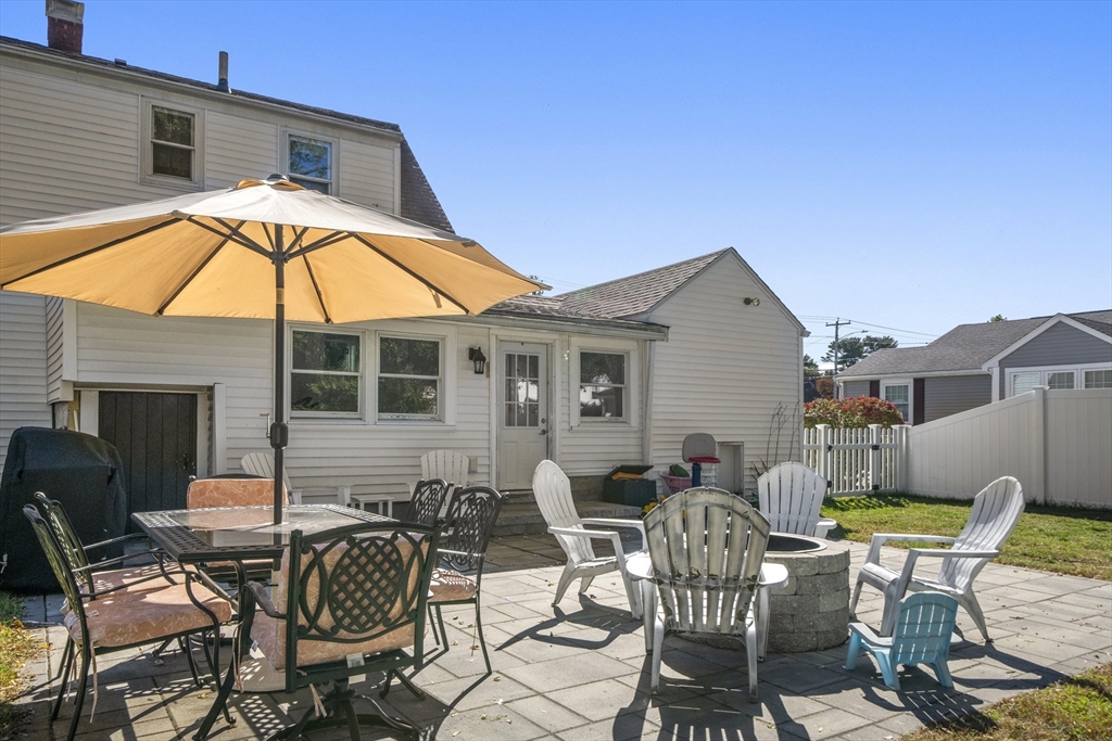 446 Ralph Talbot Street Weymouth, MA 02190 - Photo 24 of 28 a patio with tables and chairs