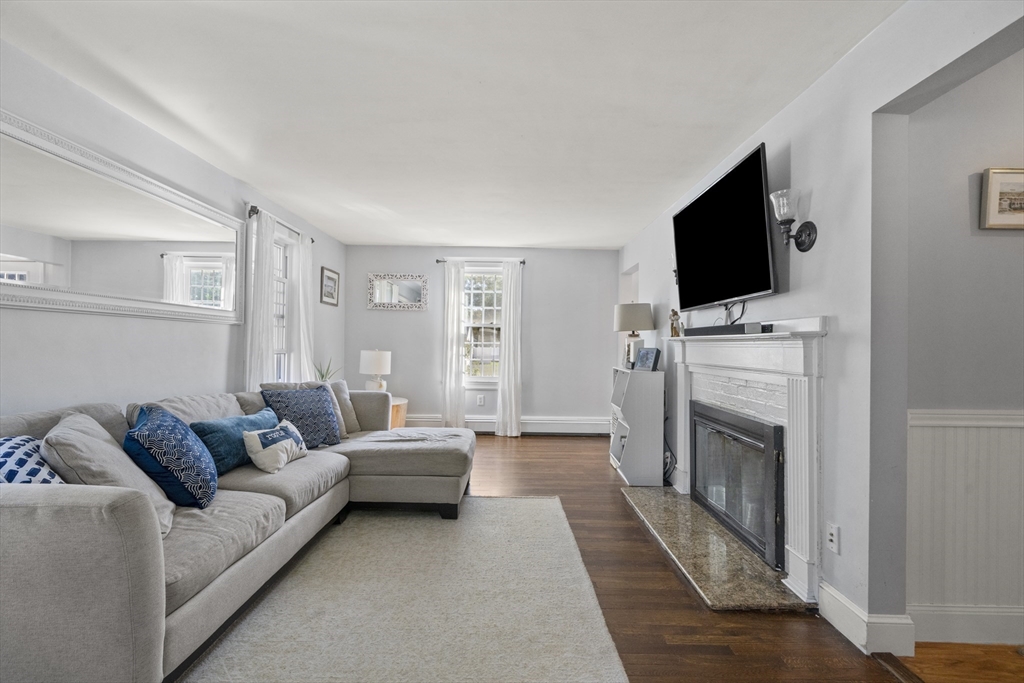 446 Ralph Talbot Street Weymouth, MA 02190 - Photo 4 of 28 a living room with furniture and a flat screen tv
