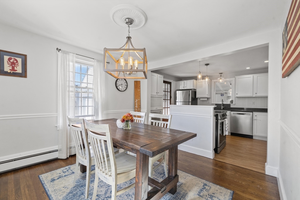 446 Ralph Talbot Street Weymouth, MA 02190 - Photo 8 of 28 a view of a dining room with furniture and wooden floor