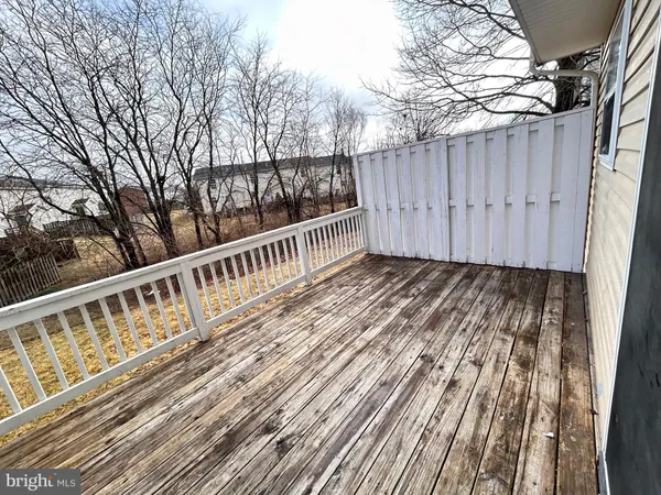 a view of balcony with wooden floor