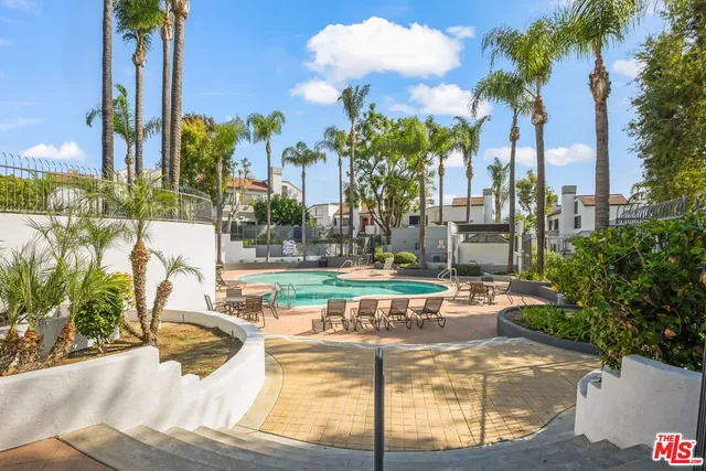 a view of a swimming pool with a patio