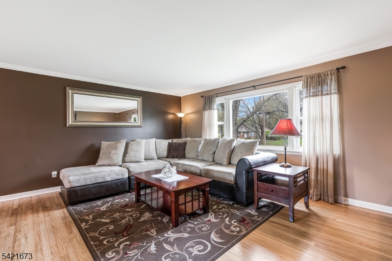 496 Rolling Hills Road Bridgewater, NJ 08807 - Photo 12 of 45 a living room with furniture and a rug