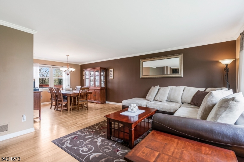 496 Rolling Hills Road Bridgewater, NJ 08807 - Photo 13 of 45 a living room with furniture a rug and a window