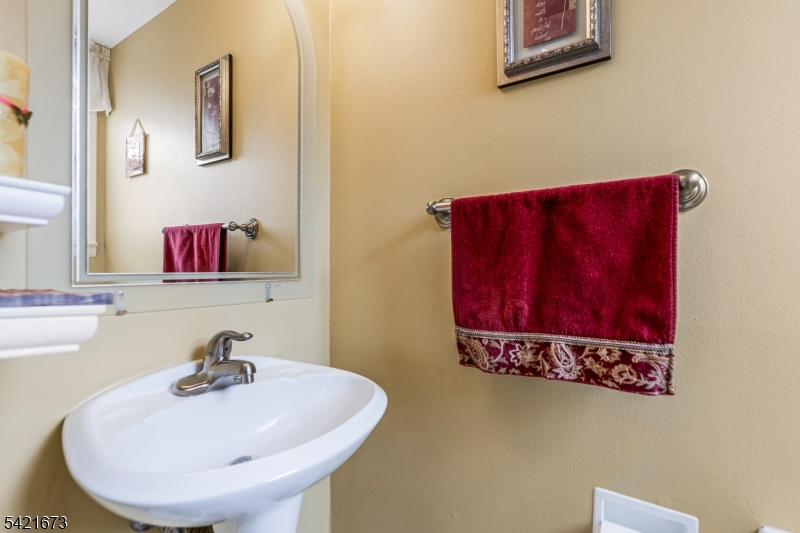 496 Rolling Hills Road Bridgewater, NJ 08807 - Photo 22 of 45 a bathroom with a sink and a mirror