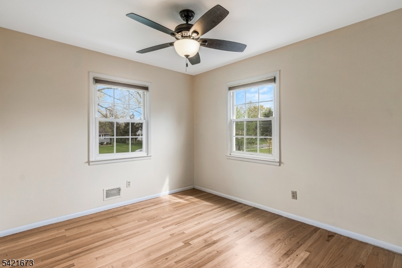 496 Rolling Hills Road Bridgewater, NJ 08807 - Photo 27 of 45 a view of an empty room with a window and a ceiling fan