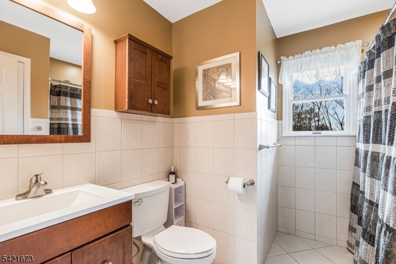 496 Rolling Hills Road Bridgewater, NJ 08807 - Photo 29 of 45 a bathroom with a sink a toilet and shower