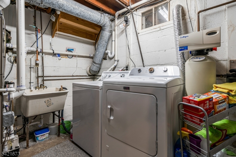 496 Rolling Hills Road Bridgewater, NJ 08807 - Photo 32 of 45 a utility room with dryer and washer