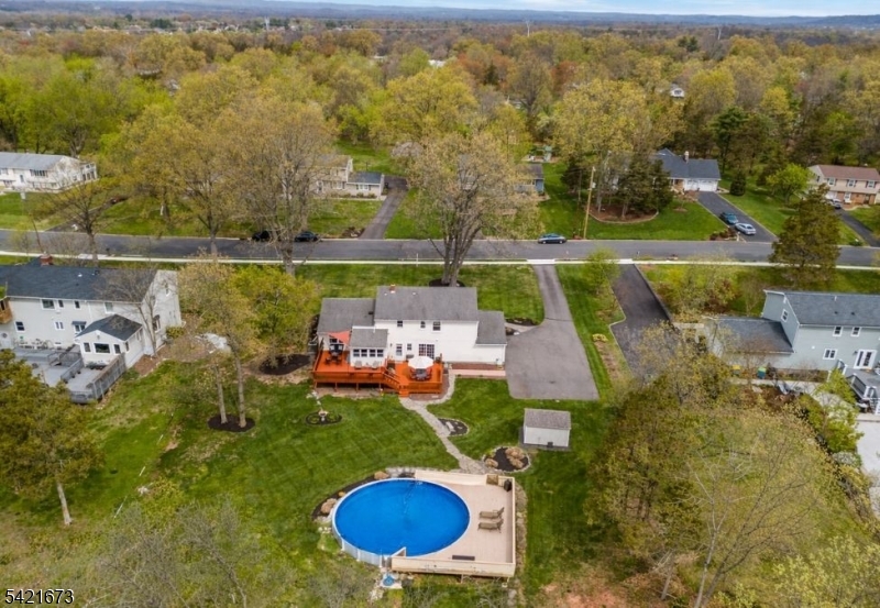 496 Rolling Hills Road Bridgewater, NJ 08807 - Photo 39 of 45 an aerial view of a house with a swimming pool yard and outdoor seating