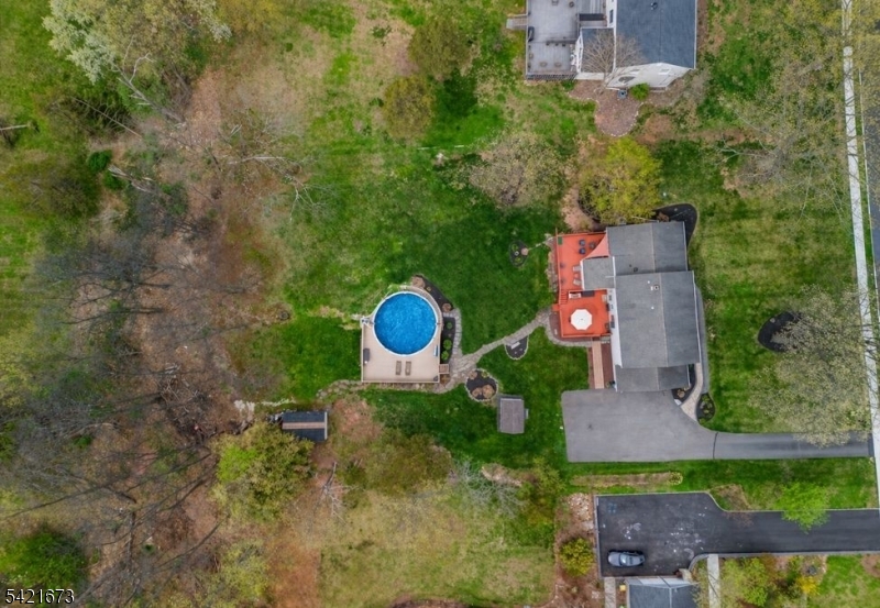 496 Rolling Hills Road Bridgewater, NJ 08807 - Photo 40 of 45 an aerial view of a house with a yard and lake view