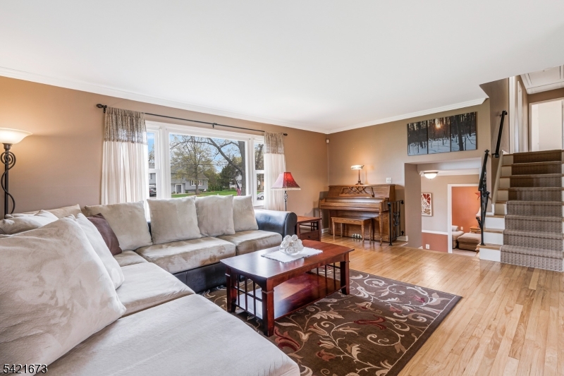 496 Rolling Hills Road Bridgewater, NJ 08807 - Photo 10 of 45 a living room with furniture and a fireplace
