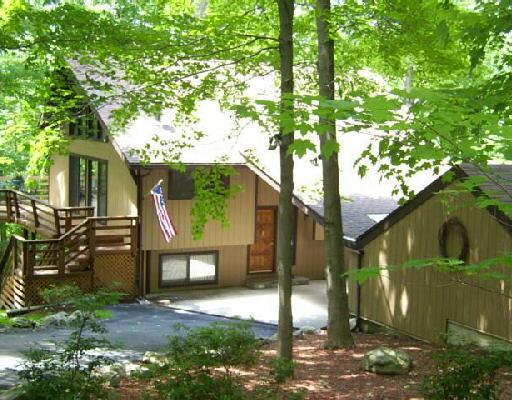 105 Blackman Road Ridgefield, CT 06877 - Photo 1 of 1 a front view of a house with garden