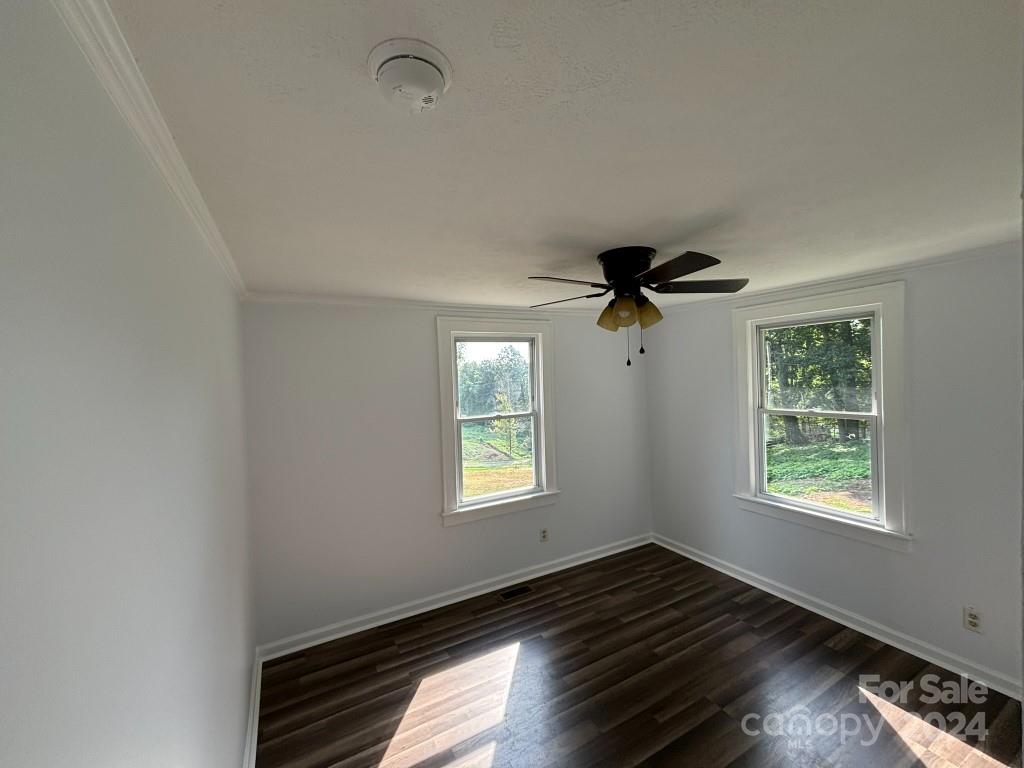 5397 Hope Road Vale, NC 28168 - Photo 25 of 32 a view of an empty room with wooden floor and a window