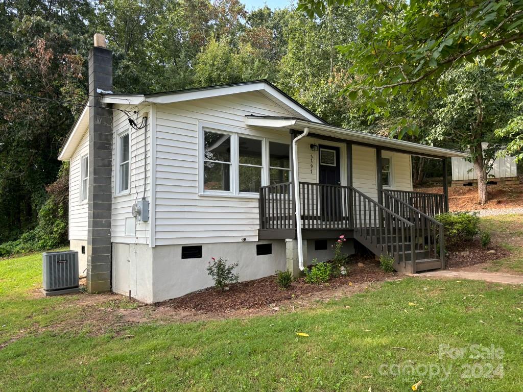 5397 Hope Road Vale, NC 28168 - Photo 8 of 32 a view of a house with a yard and plants