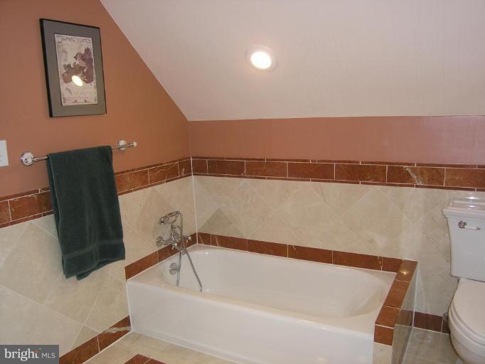 8605 Mayfair Place Silver Spring, MD 20910 - Photo 19 of 23 a bathroom with a bathtub and toilet