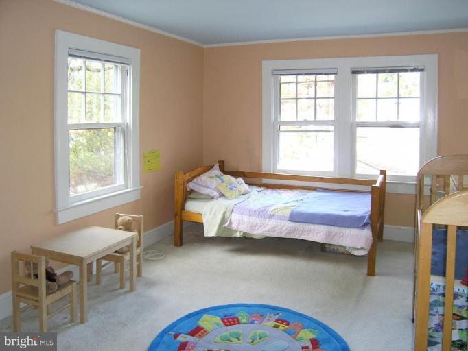8605 Mayfair Place Silver Spring, MD 20910 - Photo 3 of 23 a bedroom with a bed and a window