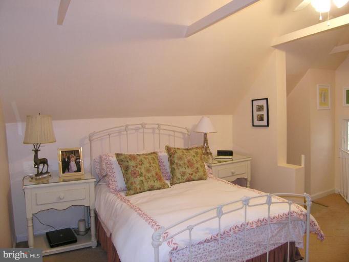 8605 Mayfair Place Silver Spring, MD 20910 - Photo 21 of 23 a bedroom with a bed and a night stand
