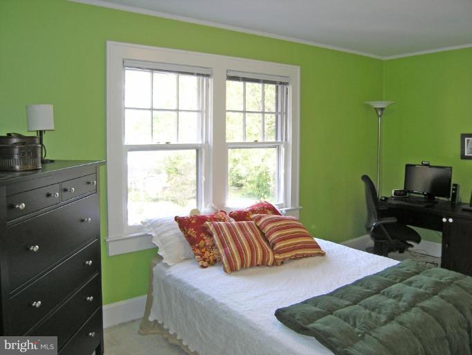 8605 Mayfair Place Silver Spring, MD 20910 - Photo 4 of 23 a bedroom with a bed and a window