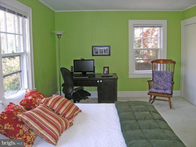 8605 Mayfair Place Silver Spring, MD 20910 - Photo 5 of 23 a bedroom with a bed and windows