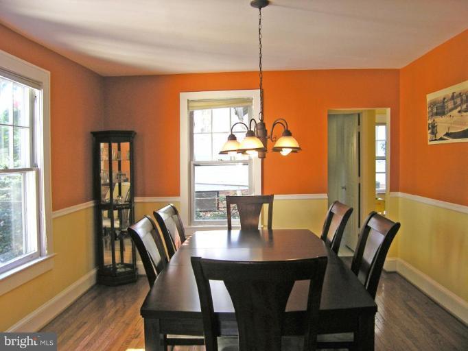 8605 Mayfair Place Silver Spring, MD 20910 - Photo 9 of 23 a view of a dining room with furniture window and wooden floor