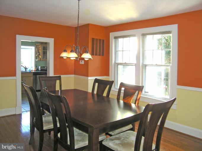 8605 Mayfair Place Silver Spring, MD 20910 - Photo 10 of 23 a view of a dining room with furniture window and wooden floor