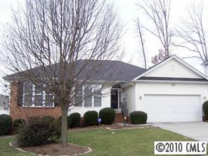 3716 Leela Palace Way Fort Mill, SC 29708 - Photo 1 of 8 a view of a house with a yard and a garden