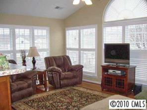 3716 Leela Palace Way Fort Mill, SC 29708 - Photo 3 of 8 a living room with furniture and a flat screen tv