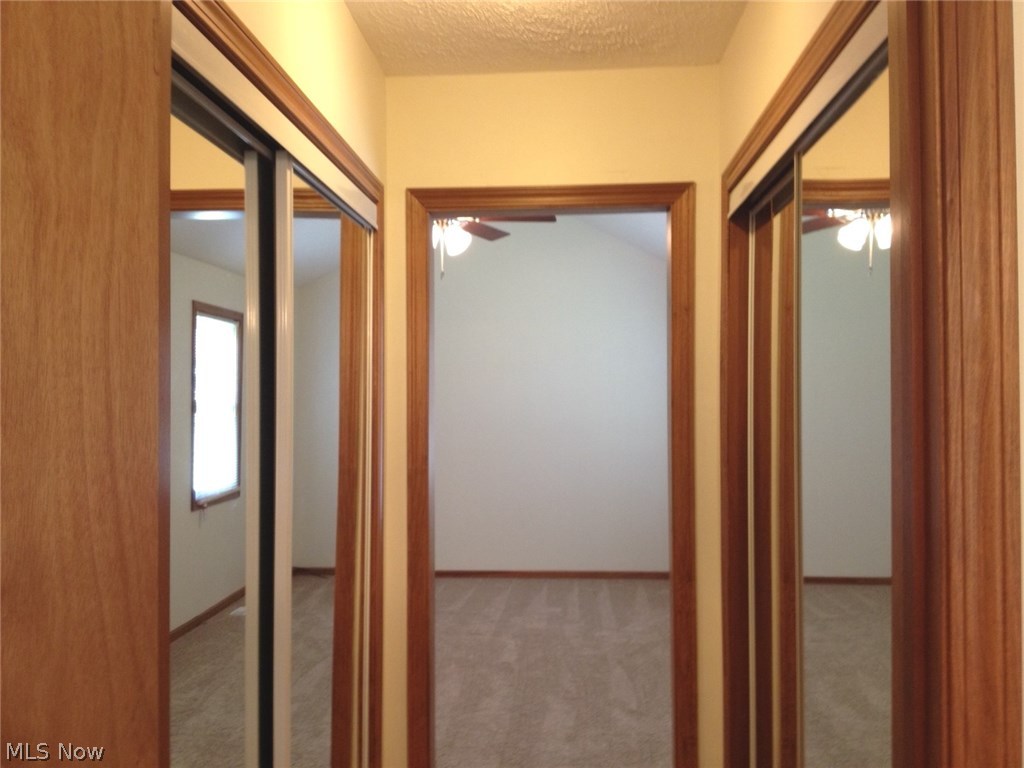 12925 Shadyway Road Cleveland, OH 44125 - Photo 11 of 12 Two sliding door closets with mirror at entrance to the master bath. There is also another walk-in closet in the master bedroom.