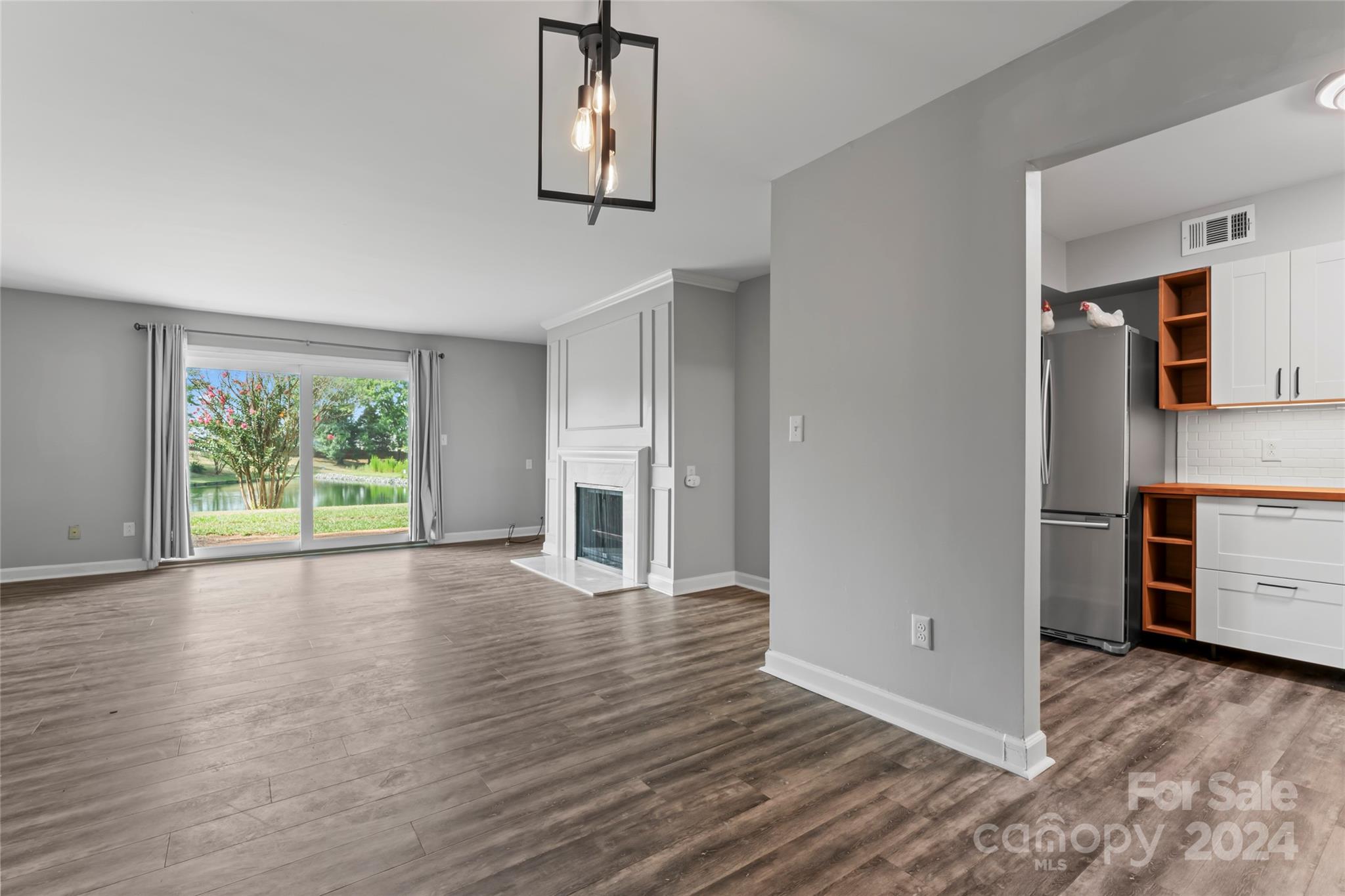 7035 Quail Hill Road Charlotte, NC 28210 - Photo 11 of 40 a view of a room with wooden floor and window